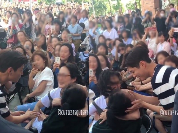 朴宝剑特地跑下台去看一位行动不便的粉丝