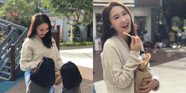 黎姿晒出照片：拿着薯条边吃边开怀大笑，与背对镜头的女儿们有爱互动