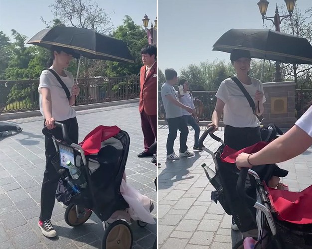 网友晒出偶遇董璇带女儿逛迪士尼照片：一个人推着婴儿车没有助理跟随